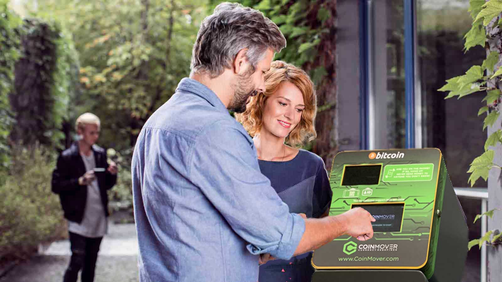 Man and woman using a CoinMover Bitcoin ATM