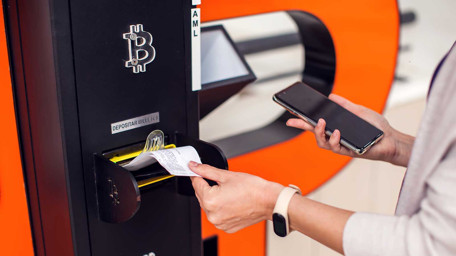 Woman retrieving her receipt for her cash to Bitcoin exchange