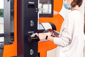 woman using bitcoin atms to buy or to sell crypto coins